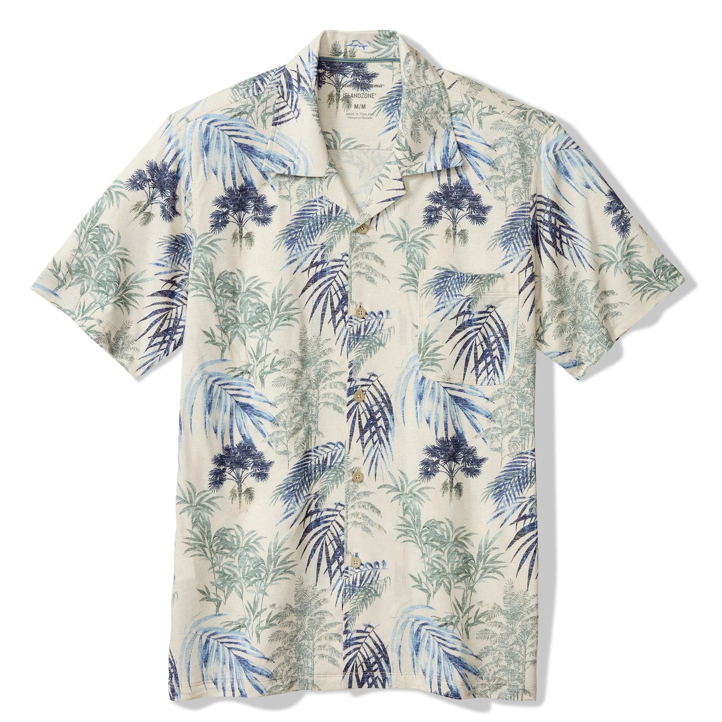 Short-sleeve shirt with tropical leaf pattern on a white background