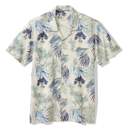 Short-sleeve shirt with tropical leaf pattern on a white background