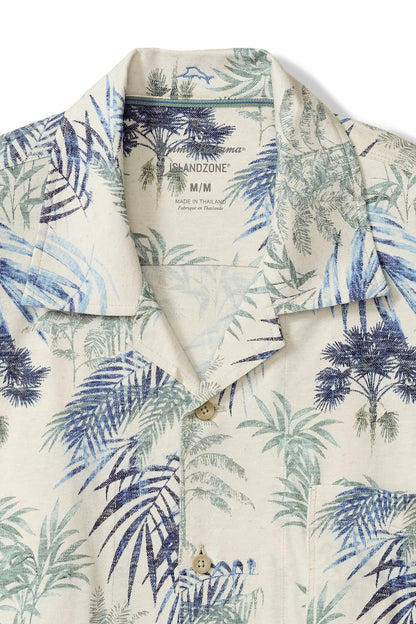 Short-sleeve shirt with tropical leaf pattern on a white background