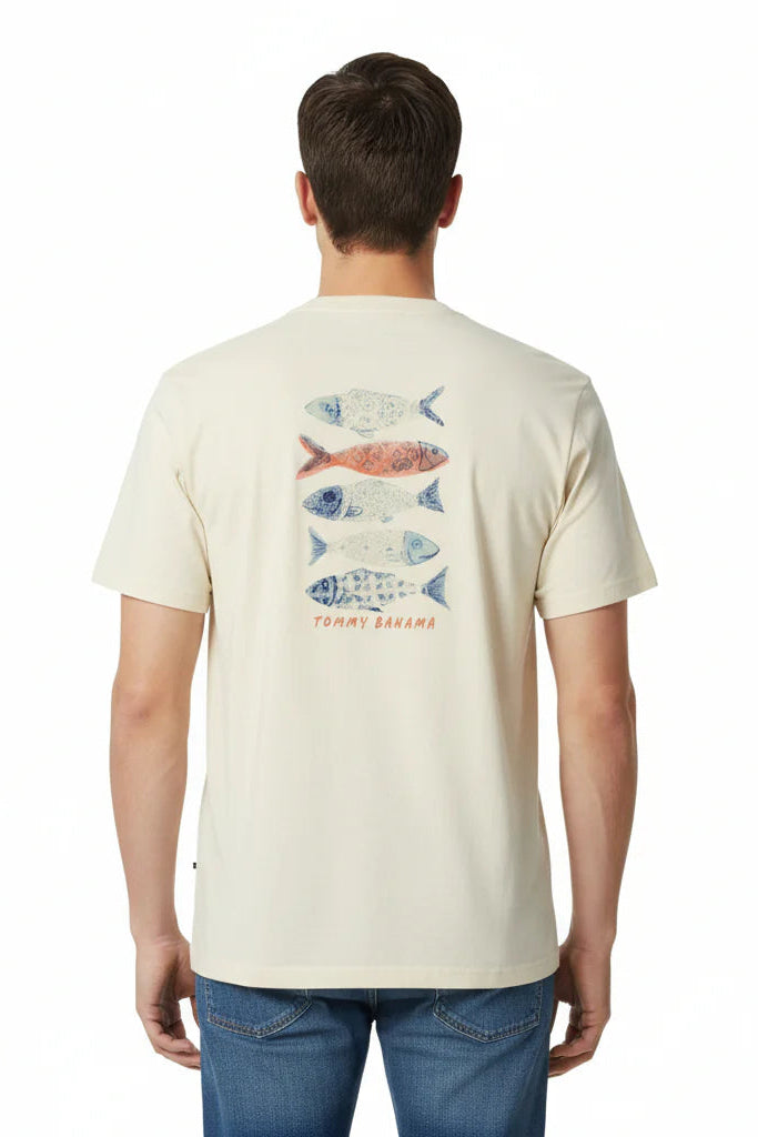 Man wearing a cream t-shirt with fish graphic on the back, standing against a white background