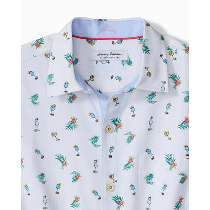 White shirt with colorful tropical pattern and Tommy Bahama label on a white background