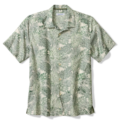 Green patterned shirt on a white background