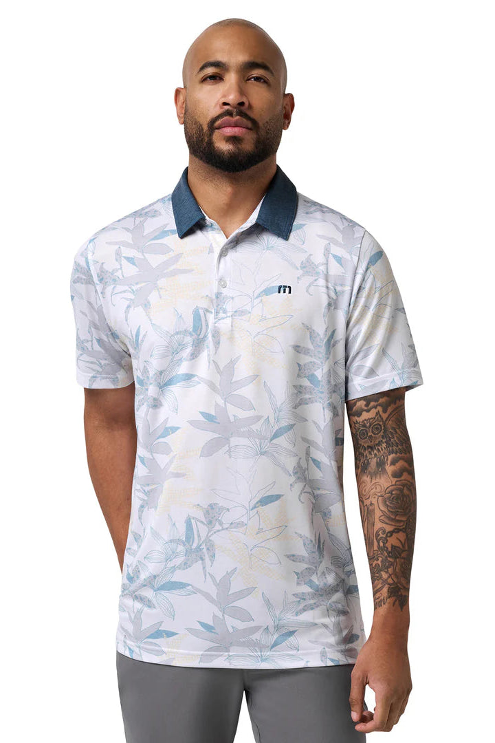 Man wearing a white polo shirt with blue accents and a logo on a white background
