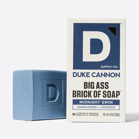 Blue soap bar and Duke Cannon packaging on a white background
