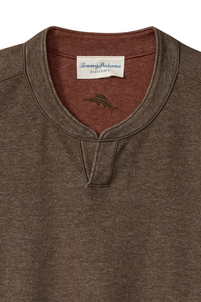 Close-up of a Tommy Bahama heather brown henley shirt with a contrasting rust-colored inner collar and a white brand label.