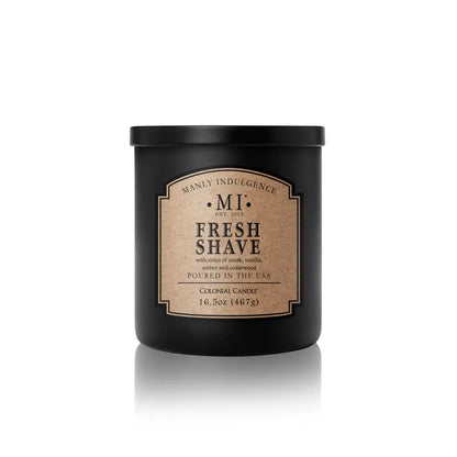 Black candle jar with 'Manly Indulgence' label on a white background