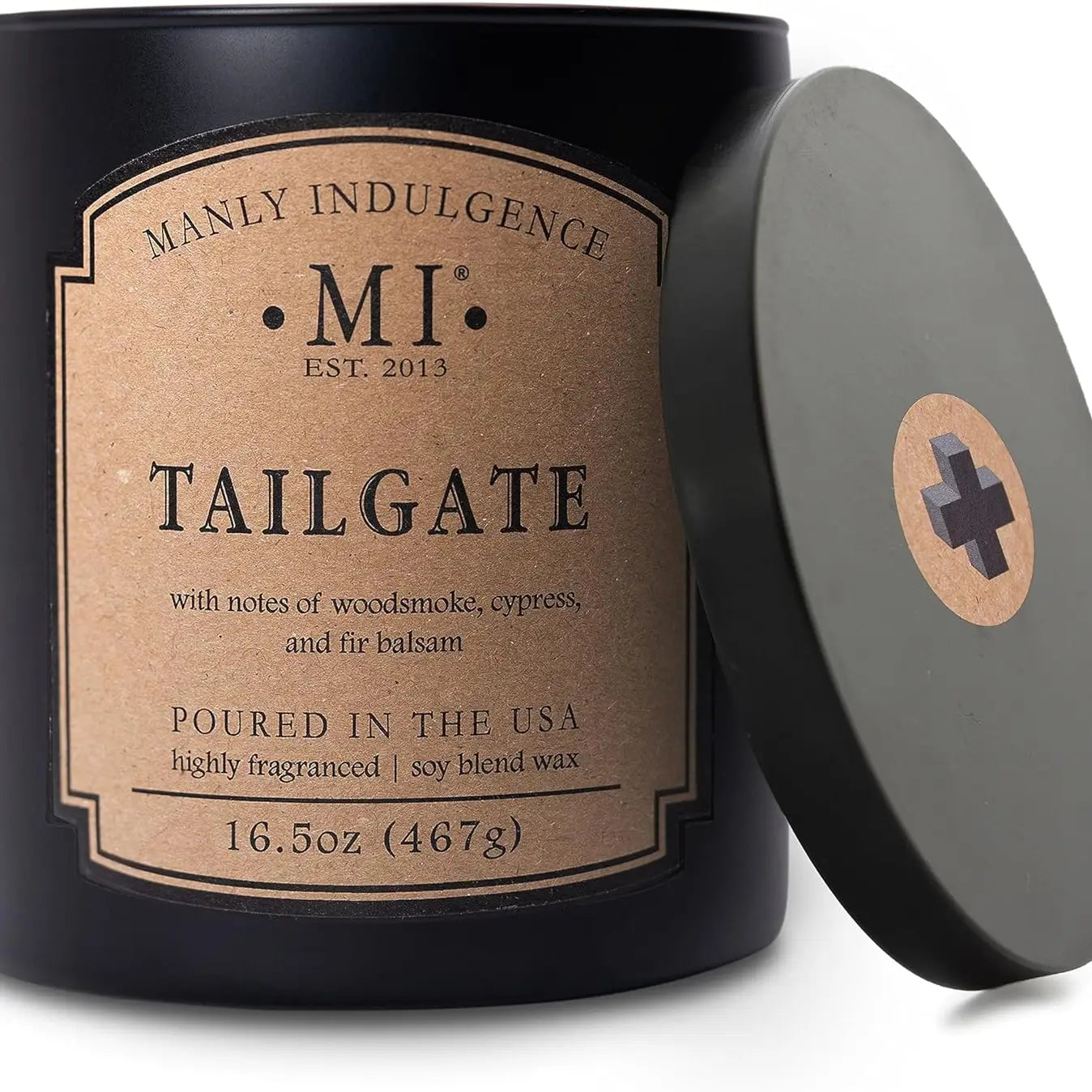 Candle with 'Manly Indulgence' label and 'Tailgate' description on a white background
