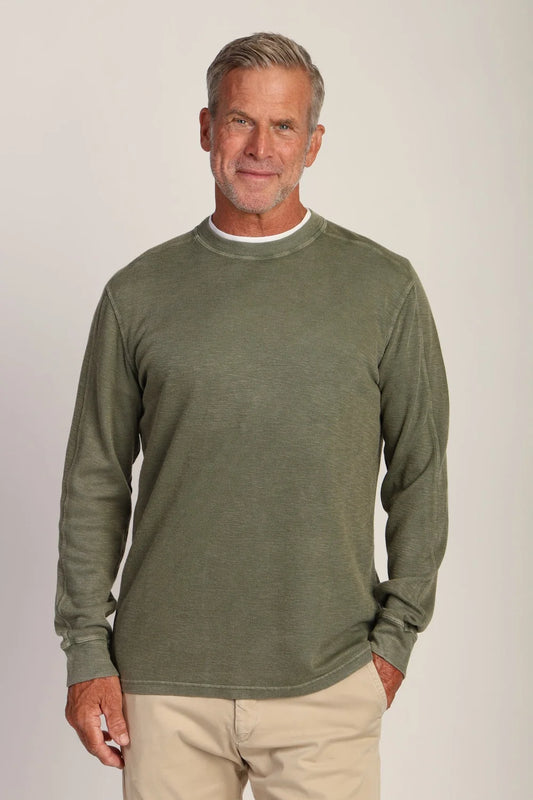 man wearing long sleeve crew in green 