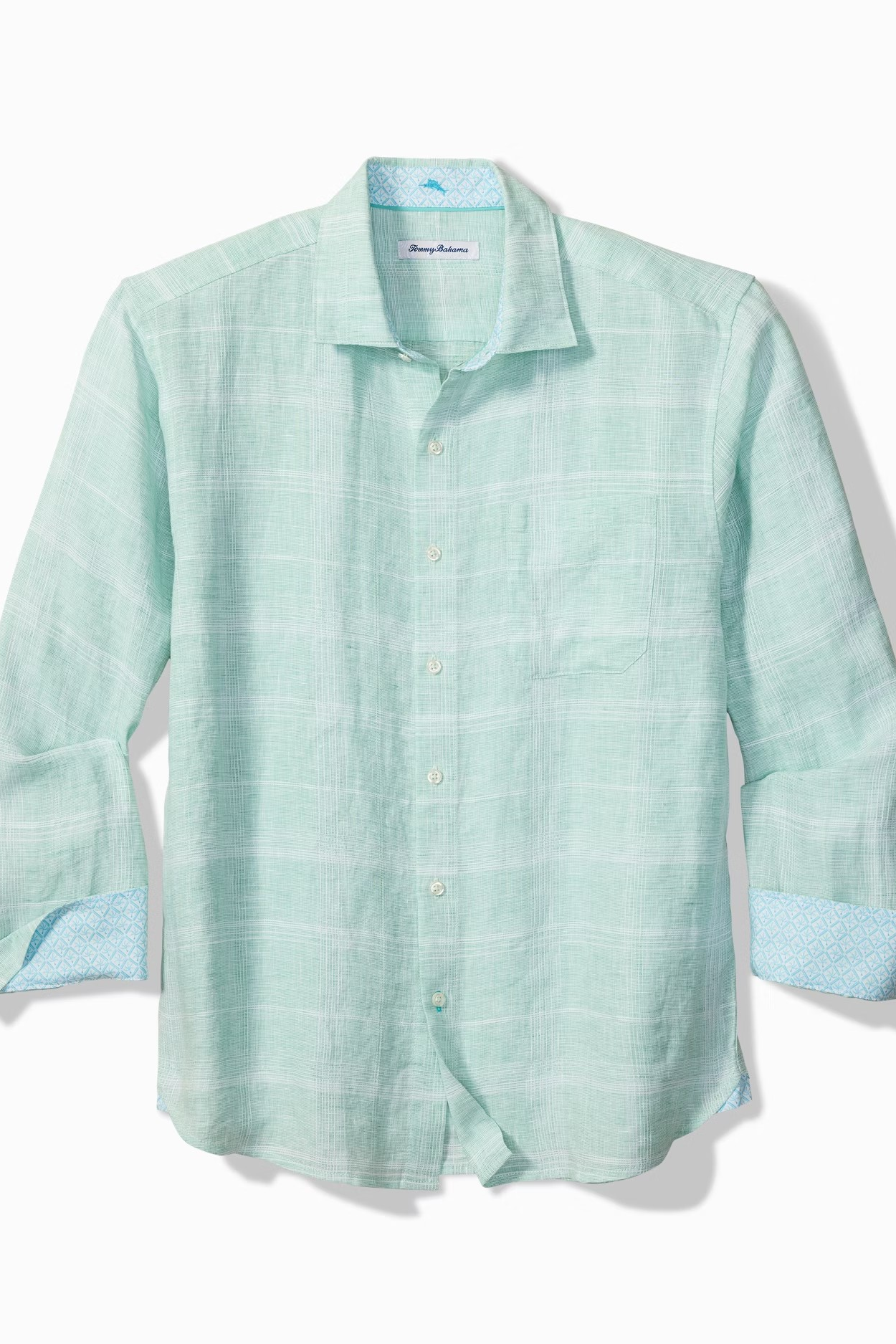 Light blue checkered shirt with rolled-up sleeves on a white background