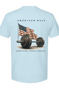 Light blue t-shirt with American flag and barbell graphic, text 'American Male' and 'Strength in Body, Strength in Character'.