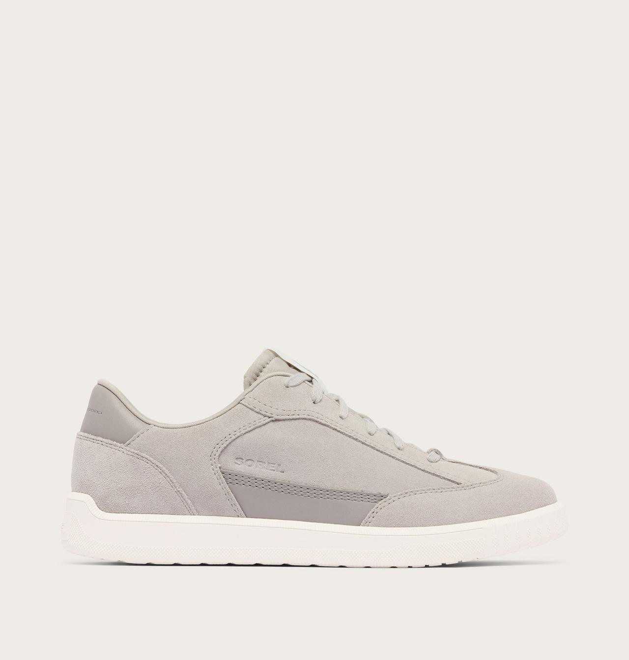 A light gray suede and mesh low-top sneaker with a thick white sole, shown in a side profile on a light beige background.