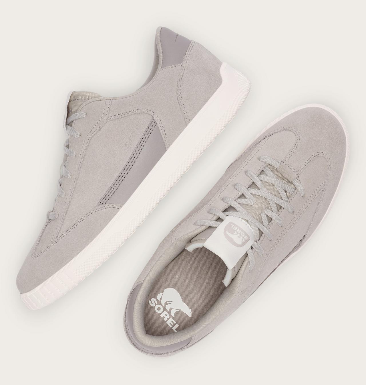 Gray sneakers with white sole on a light gray background
